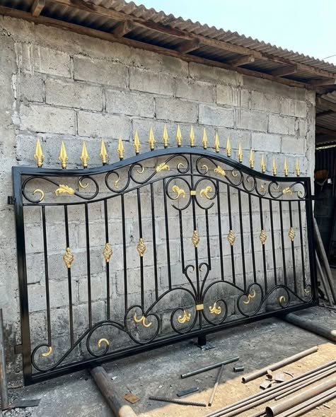 Custom black and gold wrought iron gate built by Caribbean Brothers Steel